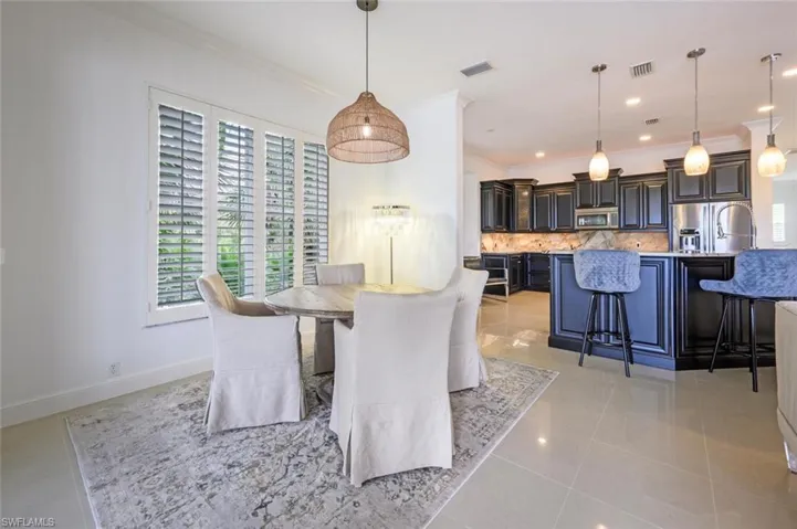 Dining area with custom lighting and Plantation Shutters