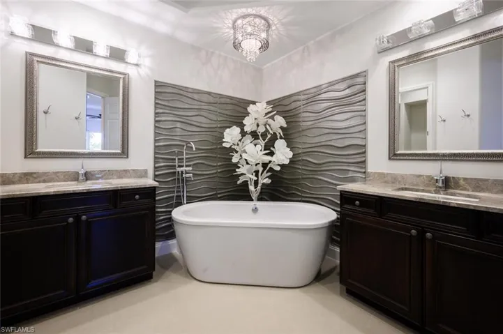 A stunning Spa like Ensuite with Accent Tile behind the stand-alone soaking tub