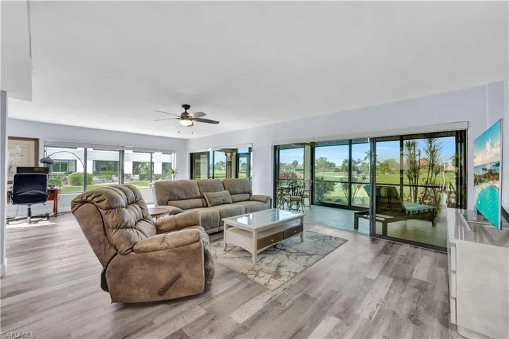 Open bright living room with access to large lanai