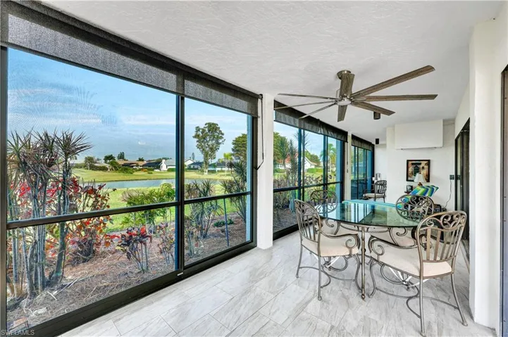 Lanai with large vinyl sliders and water view