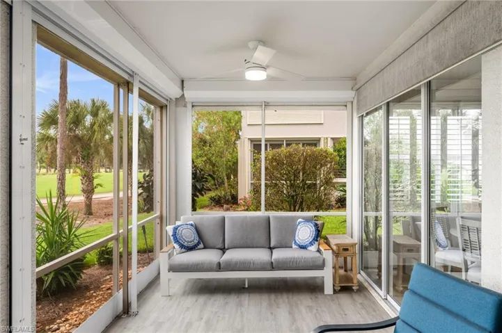 Sunroom featuring ceiling fan, wood finished floors, and outdoor lounge area