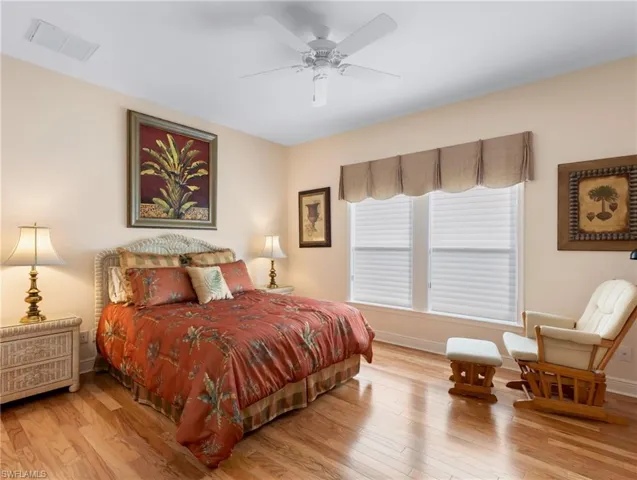 Bedroom 2 at the back of the home overlooking pool area has a full bathroom doubling as a pool bath.
