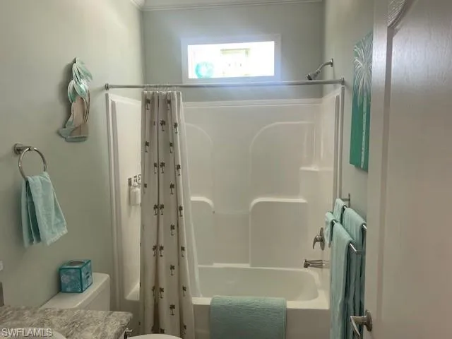 Bathroom featuring vanity and shower / bath combo