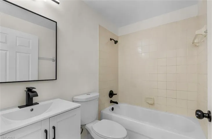 Bathroom featuring shower / bathtub combination and vanity
