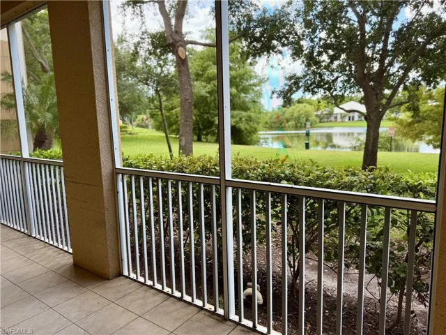 Balcony with a water view and a sunroom