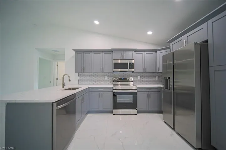 The Kitchen Comes With Quartz Countertops, Grey Soft Close Cabinets & Drawers, Grey Subway Tile Backsplash, A Floor To Ceiling Pantry, A Quartz Peninsula That Seat Three People, And Brand New Stainless Steel Appliances!