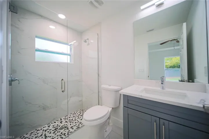 Master Bathroom With Glass Enclosed Tiled Walk-In Shower!