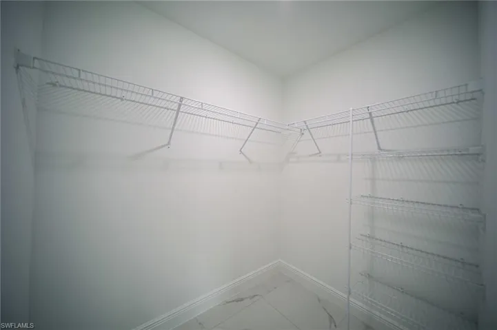 Master Bedroom Walk-In Closet With Built-In Shoe Wall!