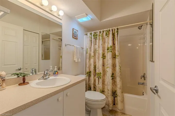 Bathroom featuring vanity and shower / bath combo