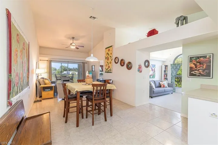 Dining area with ceiling fan and light tile patterned floors