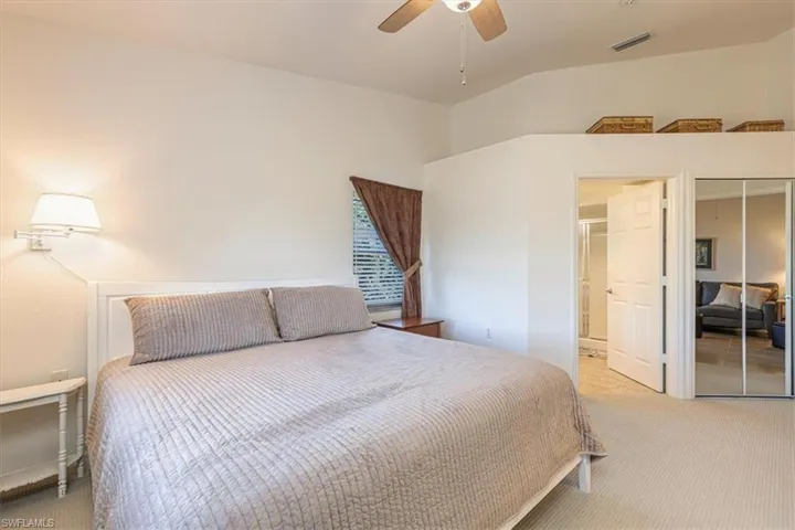 Bedroom with carpet flooring, a ceiling fan, and a closet