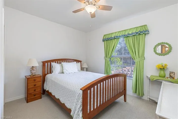 Bedroom featuring carpet floors and ceiling fan