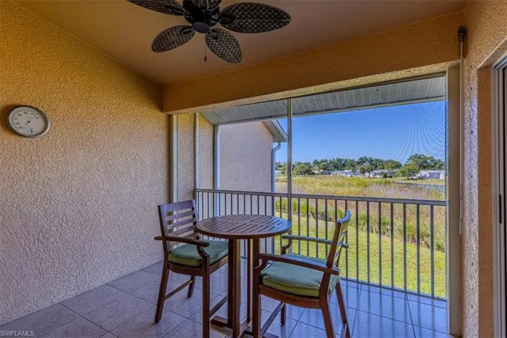 Balcony with a ceiling fan and a sunroom