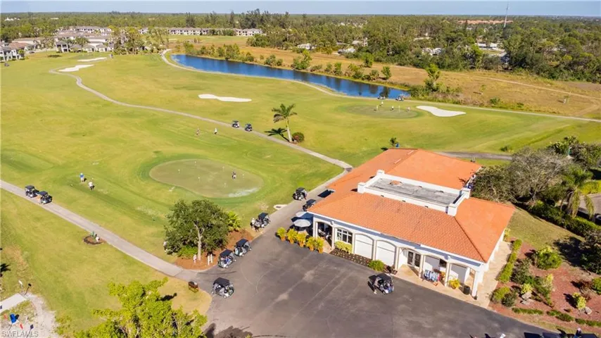 Bird's eye view of a nearby body of water and a local golf course