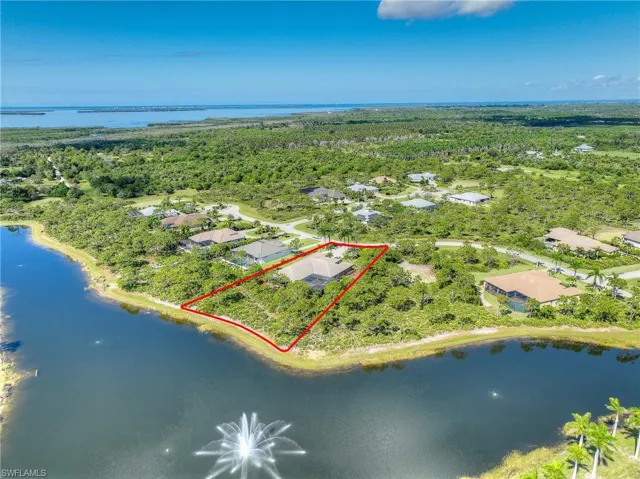 View of property location featuring lake and property parcel outlined