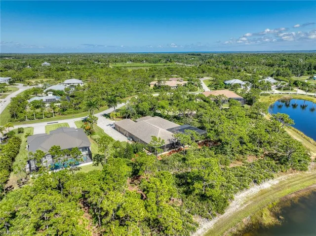 Aerial perspective of rear of home and preserve