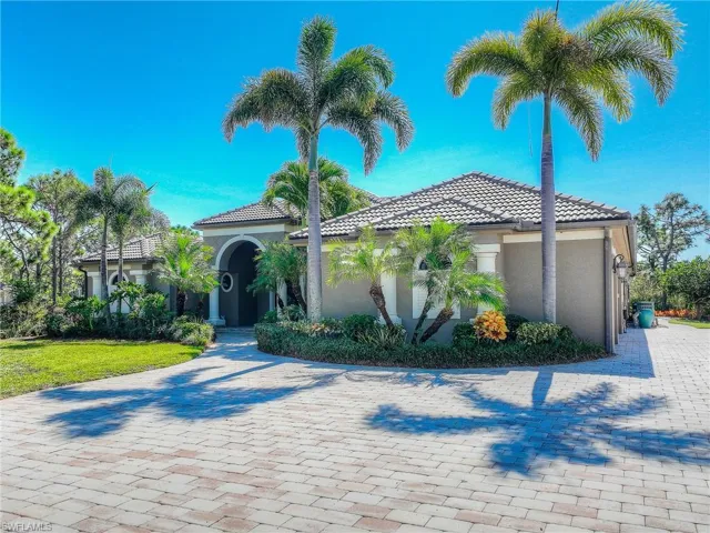 Mediterranean / spanish-style home with stucco siding and a tile roof