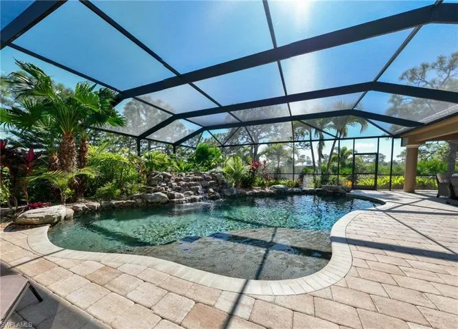 Swimming pool with an oversized lanai, pavers