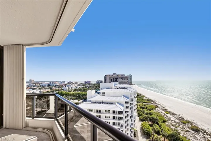 Balcony with a water view, beach view and city view