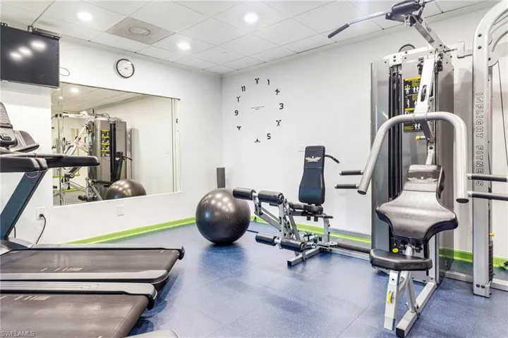 Exercise room featuring a drop ceiling