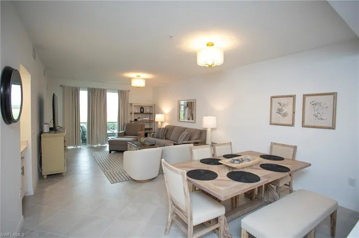 Dining room with light tile patterned floors