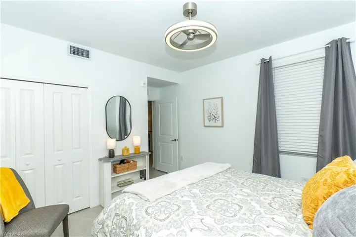 Bedroom with a closet and tile patterned floors