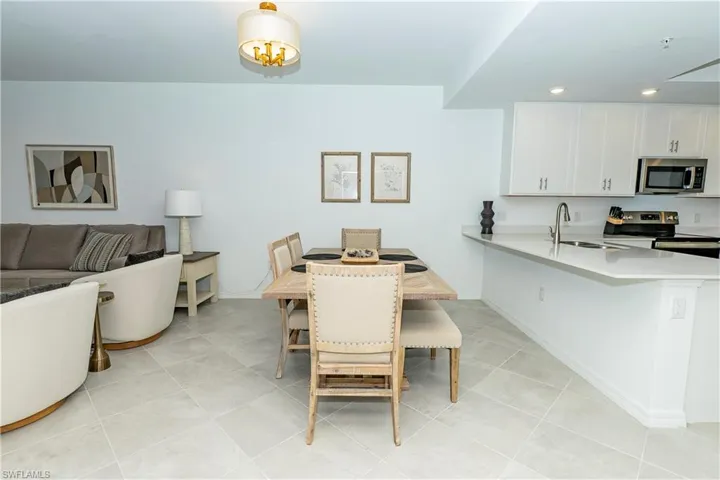 Dining room featuring recessed lighting and light tile patterned floors