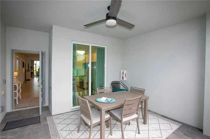 View of patio / terrace with outdoor dining area and a ceiling fan