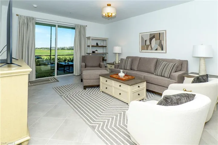 Living area featuring light tile patterned floors