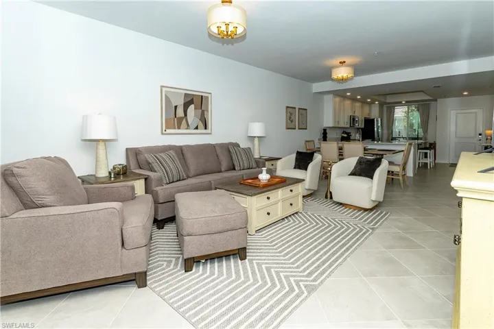 Living room with light tile patterned flooring