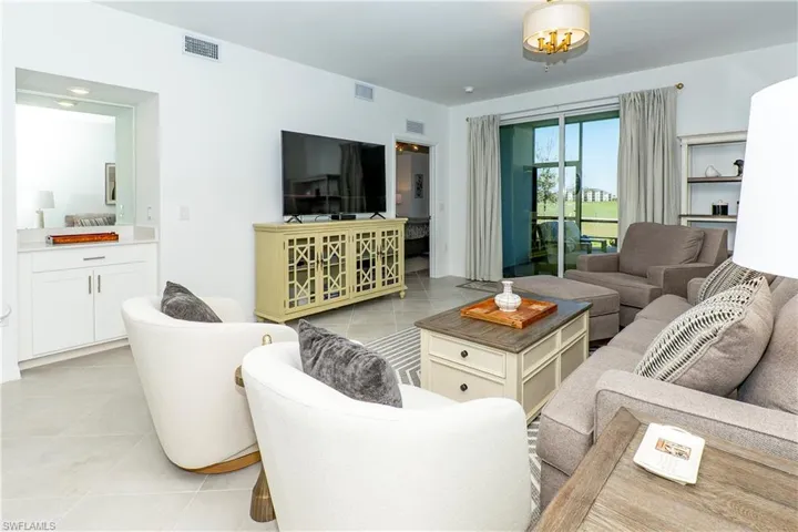 Living area with light tile patterned floors