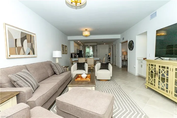 Living room featuring light tile patterned floors