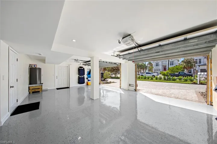 Oversized two-car garage with plenty of room for vehicles, bikes and beach toys