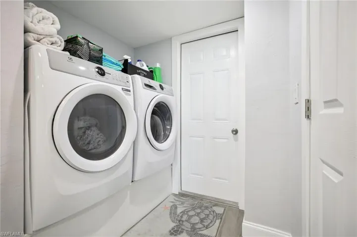Laundry room includes washing machine and dryer