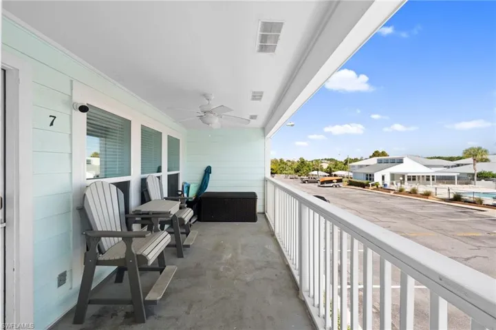 Balcony featuring a ceiling fan