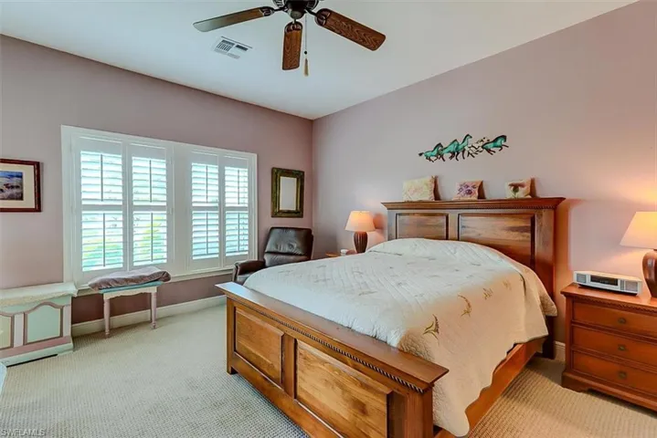 SPACIOUS OWNER'S SUITE WITH HIGH CEILING AND DOUBLE WESTERN EXPOSURE WINDOWS.  ENTRANCE TO UPPER DECK IS TO LEFT.