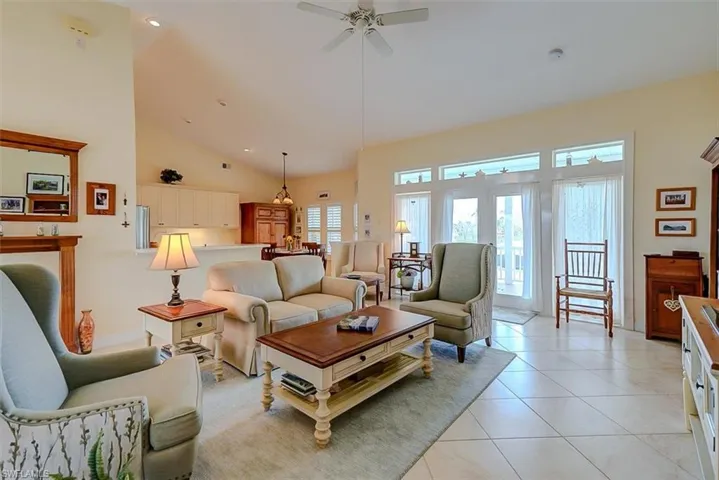 OPEN FLOOR PLAN.  CATHEDRAL CEILING.  RECESSED CEILING LIGHTING.  FRENCH DOORS (WITH TRANSOM WINDOWS) LEAD TO SCREENED UPPER DECK.  ENTRANCE TO OWNER'S SUITE IS AT RIGHT REAR.