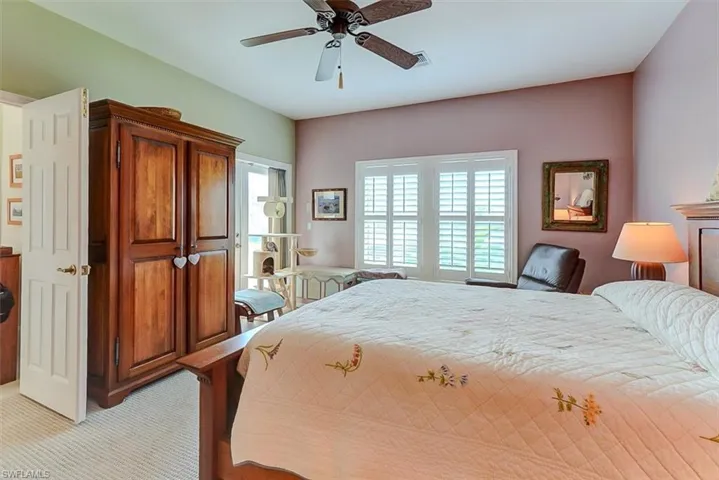 OWNER'S SUITE SHOWING ENTRANCE TO LIVING AREA AND TO UPPER SCREENED DECK (MIDDLE REAR)