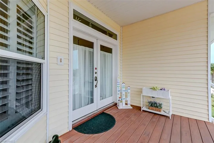 DOUBLE-DOOR ENTRY W/IMPACT RESISTANT GLASS WITH TRANSOM WINDOW.  EASTERN EXPOSURE.  IMPACT WINDOWS THROUGHOUT.  COMPOSITE DECKING.
