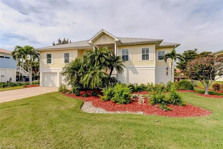 LUSHLY LANDSCAPED PROPERTY.  2 CAR GARAGE.  PAVERED DRIVE.