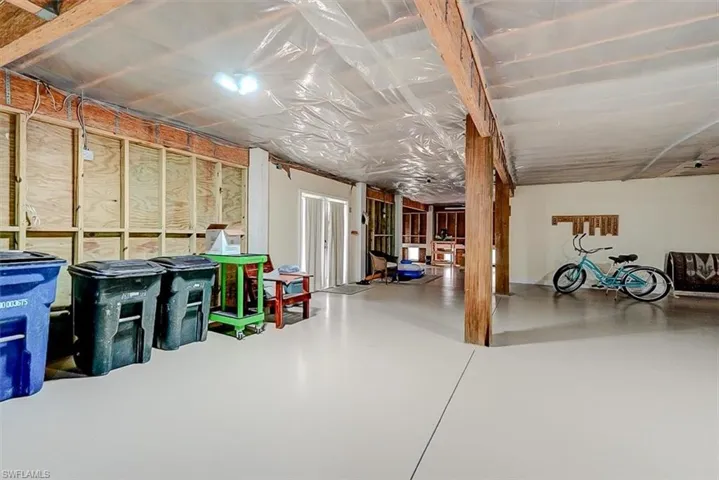 LOTS OF SPACE FOR ALL YOUR BEACH TOYS.  IMPACT GLASS DOORS LEAD TO POOL AREA