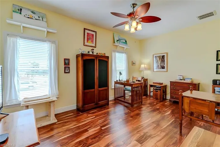 SPACIOUS GUEST BEDROOM WITH BEAUTIFUL MANUFACTURED WOOD FLOORING