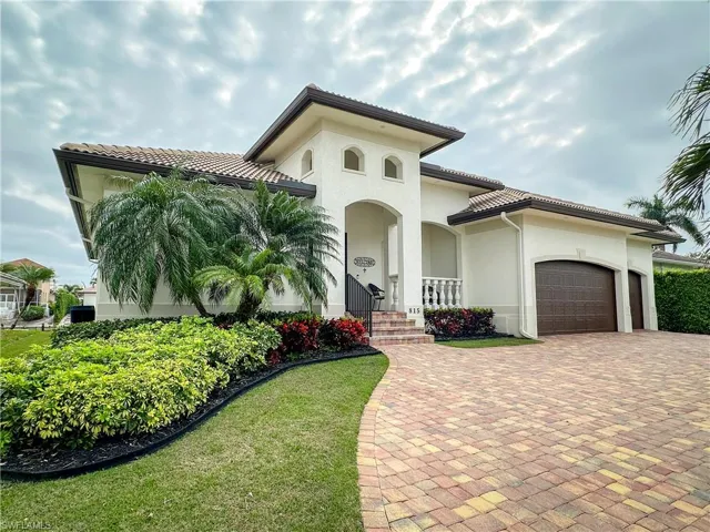 Front with well maintained landscaping