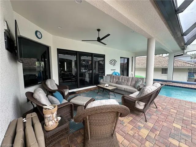 Lanai,  featuring ceiling fan and a comfortable seating outdoor  area