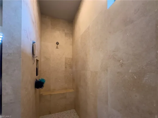 Primary Bathroom featuring a large tile walk in shower