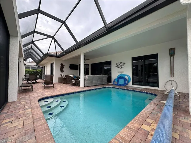 View of heated pool with solar cover.