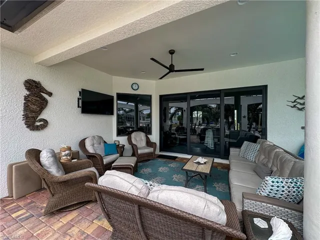 View of patio / terrace featuring ceiling fan and outdoor lounge area