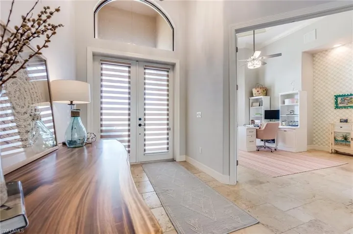 Entryway with ceiling fan, french doors, a healthy amount of sunlight, and crown molding
