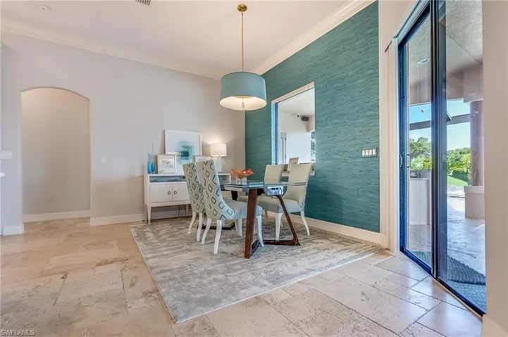 Dining area featuring ornamental molding