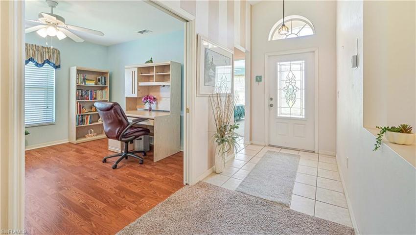 Foyer opens to a covered screened entry.
